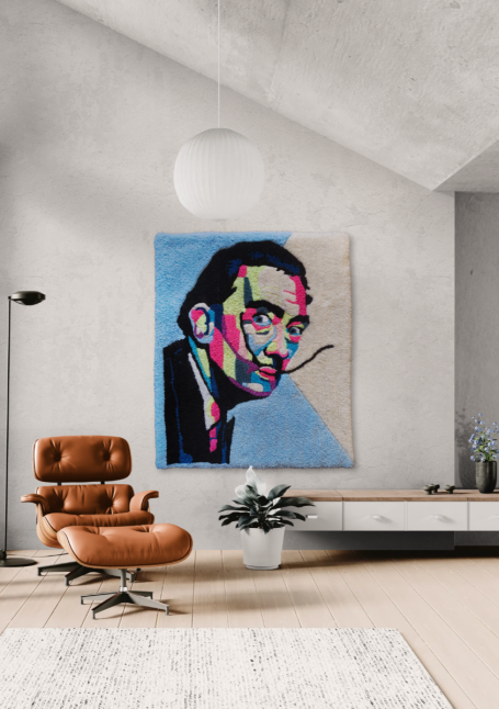 A vibrant portrait of a man with a moustache, displayed above a modern armchair in a stylish room.